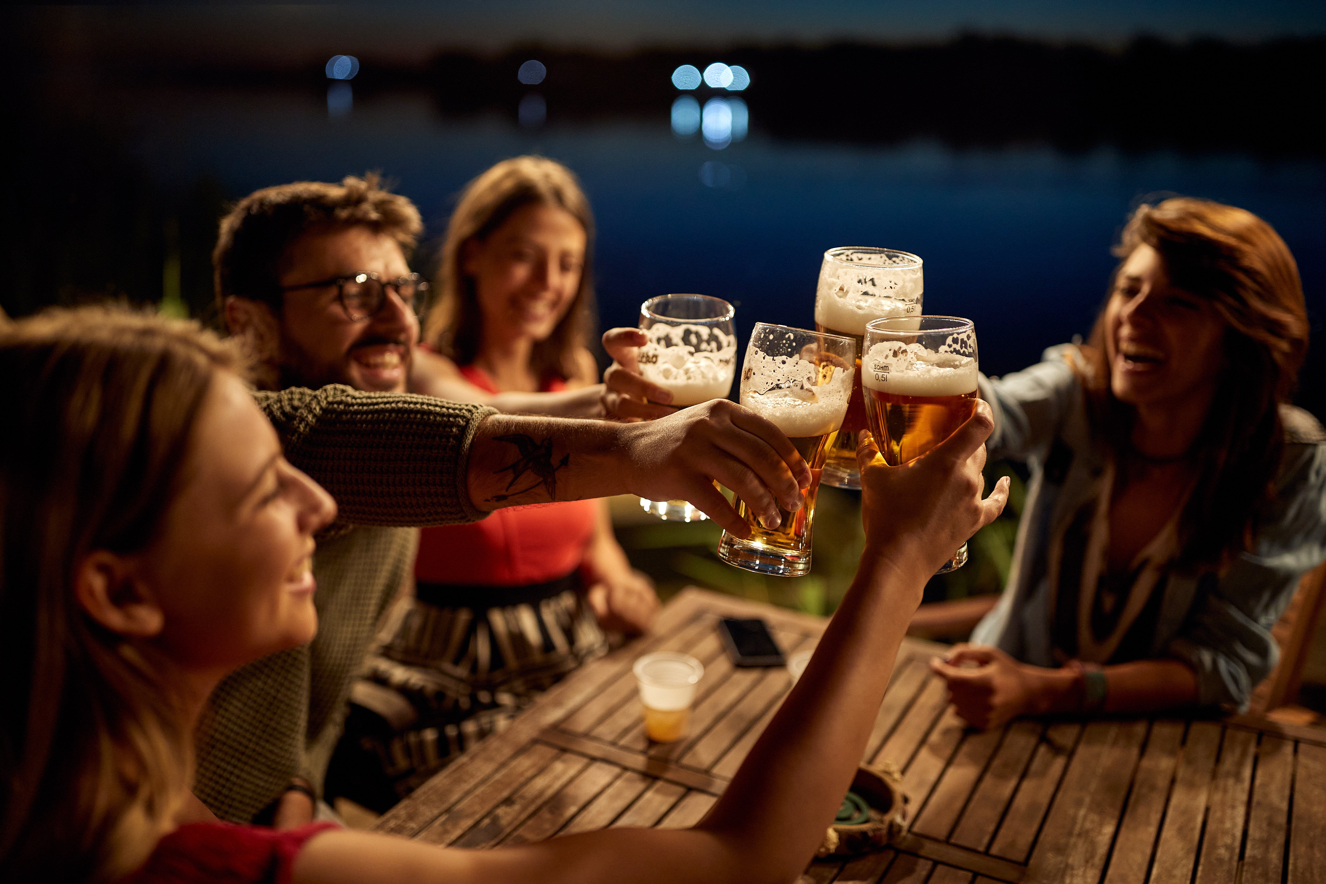 group of friends drinking together at a table